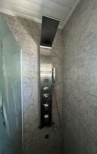 a bathroom with a shower with a glass door at La China in Neuquén