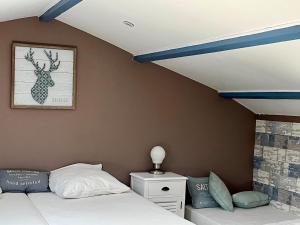 En eller flere senge i et værelse på Superbe duplex - terrasse ensoleillée, 300m plage