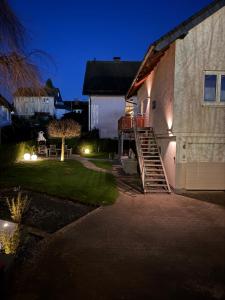 a house with a staircase leading up to a house at Casa Brocktega in Bestwig