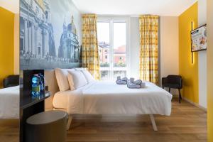 Postel nebo postele na pokoji v ubytování B&B Hotel Roma San Lorenzo Termini