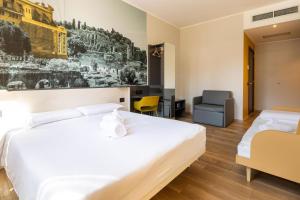Postel nebo postele na pokoji v ubytování B&B Hotel Roma San Lorenzo Termini
