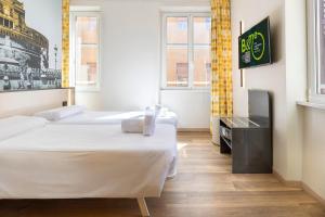 Postel nebo postele na pokoji v ubytování B&B Hotel Roma San Lorenzo Termini