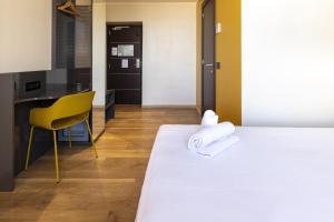 Postel nebo postele na pokoji v ubytování B&B Hotel Roma San Lorenzo Termini
