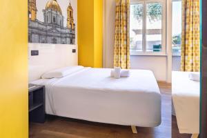 Postel nebo postele na pokoji v ubytování B&B Hotel Roma San Lorenzo Termini