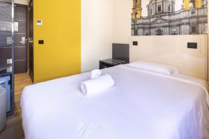 Postel nebo postele na pokoji v ubytování B&B Hotel Roma San Lorenzo Termini