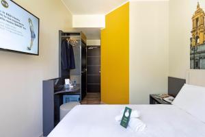 Postel nebo postele na pokoji v ubytování B&B Hotel Roma San Lorenzo Termini