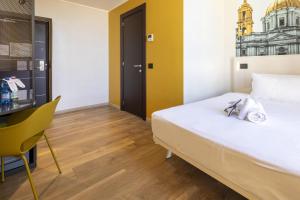 Postel nebo postele na pokoji v ubytování B&B Hotel Roma San Lorenzo Termini