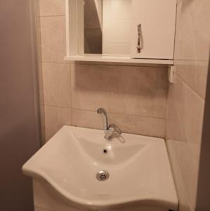 a white sink in a bathroom with a mirror at Pekin Spa and Suites in Istanbul