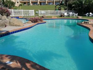a large pool with blue water in a resort at Secret Sands Glenmore Beach in Port Edward