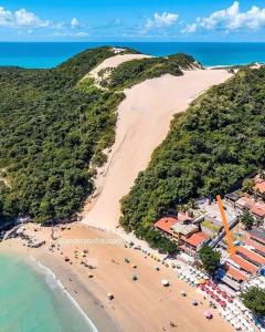 an aerial view of a beach with a resort at Coco Beach Apart 5B in Natal