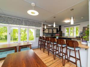 a kitchen with a wooden table and chairs at YHA Street in Street