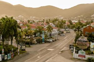 a view of a town with palm trees and a street at Commodore Suites in Simpson Bay