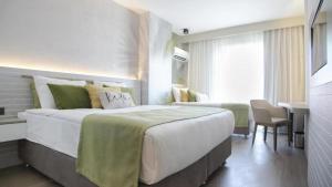 Postel nebo postele na pokoji v ubytování Side Square Hotel