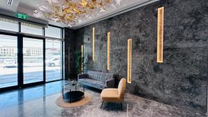 Posezení v ubytování Sunday Sheikh Zayed Road Concord Tower 1 BR by Belvilla