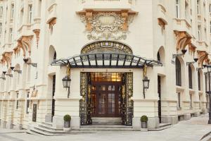 a facade of a building with a door at The Palace, a Luxury Collection Hotel, Madrid in Madrid