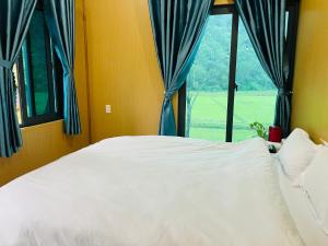 Ένα ή περισσότερα κρεβάτια σε δωμάτιο στο Hieu-Homestay