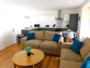 a living room with a couch and a table at No 5 - Modern 2 bedroom Apartment in Lanark Town Centre in Lanark