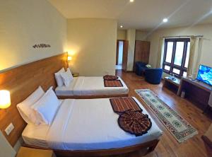 Postel nebo postele na pokoji v ubytování Gakyil Thimphu