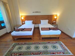 Postel nebo postele na pokoji v ubytování Gakyil Thimphu + 12 fotografií