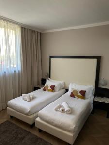 Postel nebo postele na pokoji v ubytování Hotel Comtur + 36 fotografií