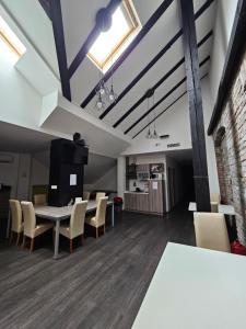 a dining room with a table and chairs at KAPTOL Rooms in Zagreb +23 photos