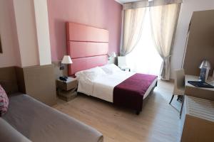 Кровать или кровати в номере Hotel Ligure