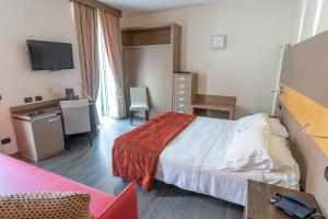 Кровать или кровати в номере Hotel Ligure