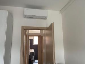 a room with a ceiling fan and a door at M&M BERGAMO CENTER - Modern flat with FREE WIFI - Rent BIKE in Bergamo