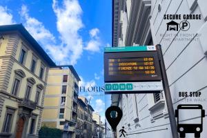 a sign for a bus stop on a city street at Flòris Luxury Apartment NEW in Florence