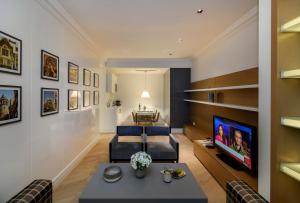a living room with a couch and a table at Atik Suite Taksim in Istanbul