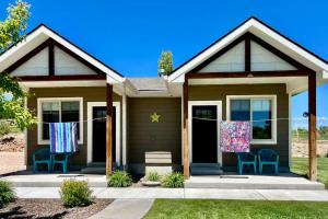 a house with clothes hanging on a clothesline at Hillside Farm’s Cottages in Paris