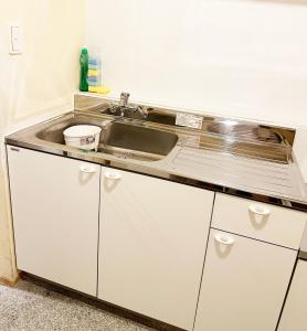 a kitchen with a sink and a counter at Hananogo Ikebukuro - Vacation STAY 16071v in Tokyo