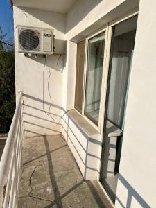 a window with a air conditioner on the side of a building at апарт отель Voyage гостиничные номера Стандарт in Shymkent