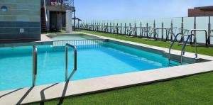 a swimming pool on the side of a building at Hotel Oasis Plaza in Benidorm