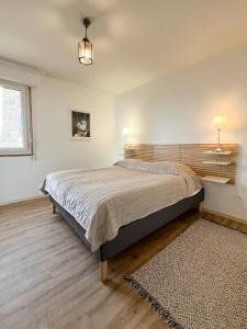Ένα ή περισσότερα κρεβάτια σε δωμάτιο στο Bel Appartement Face à La Plage