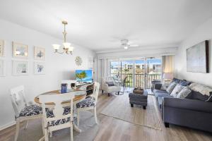 a living room with a couch and a table at Coastal condo just a short walk away from the beach in Marco Island