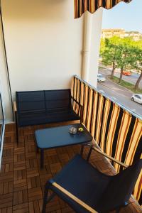 Posezení v ubytování Charmant appartement avec terrasse