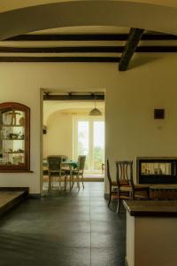 a dining room with a table and chairs and a window at Casa YUVI in Vetralla