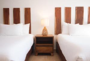 Katil atau katil-katil dalam bilik di Hotel B10 - Distinctive Hotel-