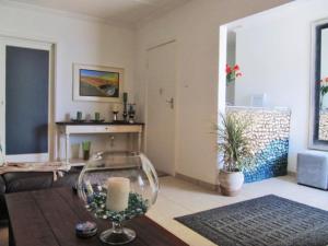 a living room with a glass bowl on a table at Pebble Stone House Bed & Breakfast in Swakopmund