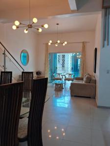 a living room with a couch and a table at Casa completa Cop30 - Centro in Belém