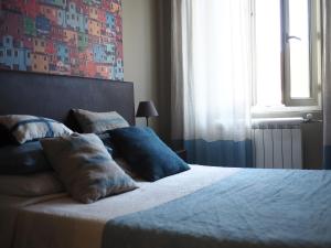 Postel nebo postele na pokoji v ubytování Logis Hôtel Le Glacier