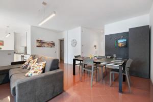 a living room with a couch and a table at Domaso front lake in Domaso