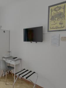 TV a/nebo společenská místnost v ubytování B&B DORMIRE DAI GRIMALDI