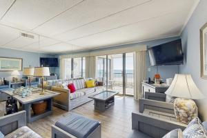 a living room with a couch and a tv at Breakaway East 512 in Ocean City