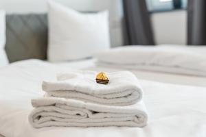 a pile of towels with a engagement ring on top at Stilvolles Apartment Bodensee A2 in Ravensburg +2 photos