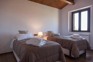 Postel nebo postele na pokoji v ubytování Casa Cal Saboya