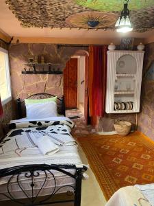 Postel nebo postele na pokoji v ubytování Auberge IMIN TAGHYA + 11 fotografií