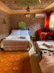 Postel nebo postele na pokoji v ubytování Auberge IMIN TAGHYA