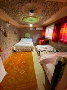 Postel nebo postele na pokoji v ubytování Auberge IMIN TAGHYA